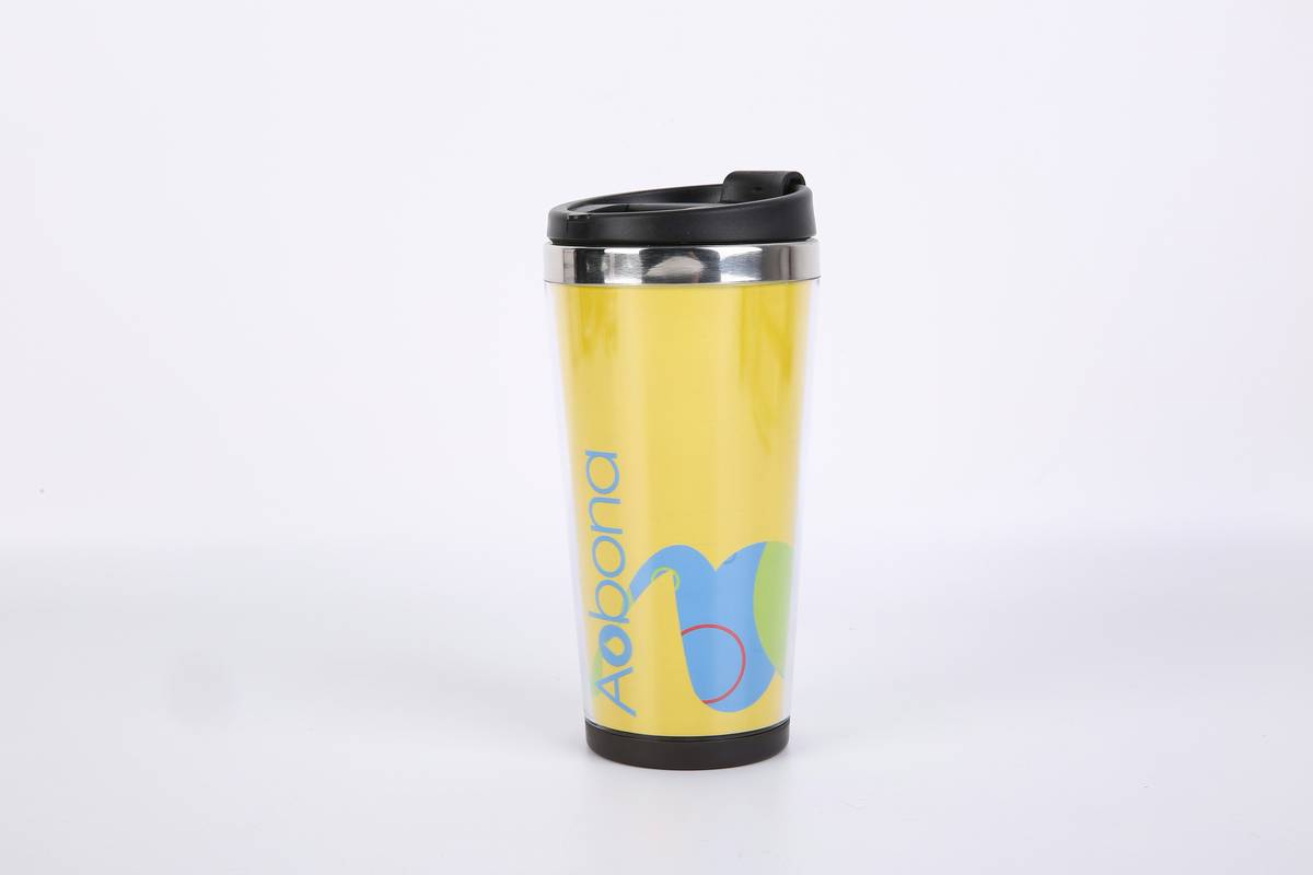 zero foxtrot coffee mug on a rustic wooden table with morning light highlighting its brushed steel finish