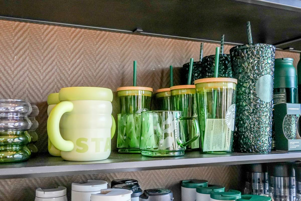 Green life stainless steel cookware set on a reclaimed wood countertop with morning light