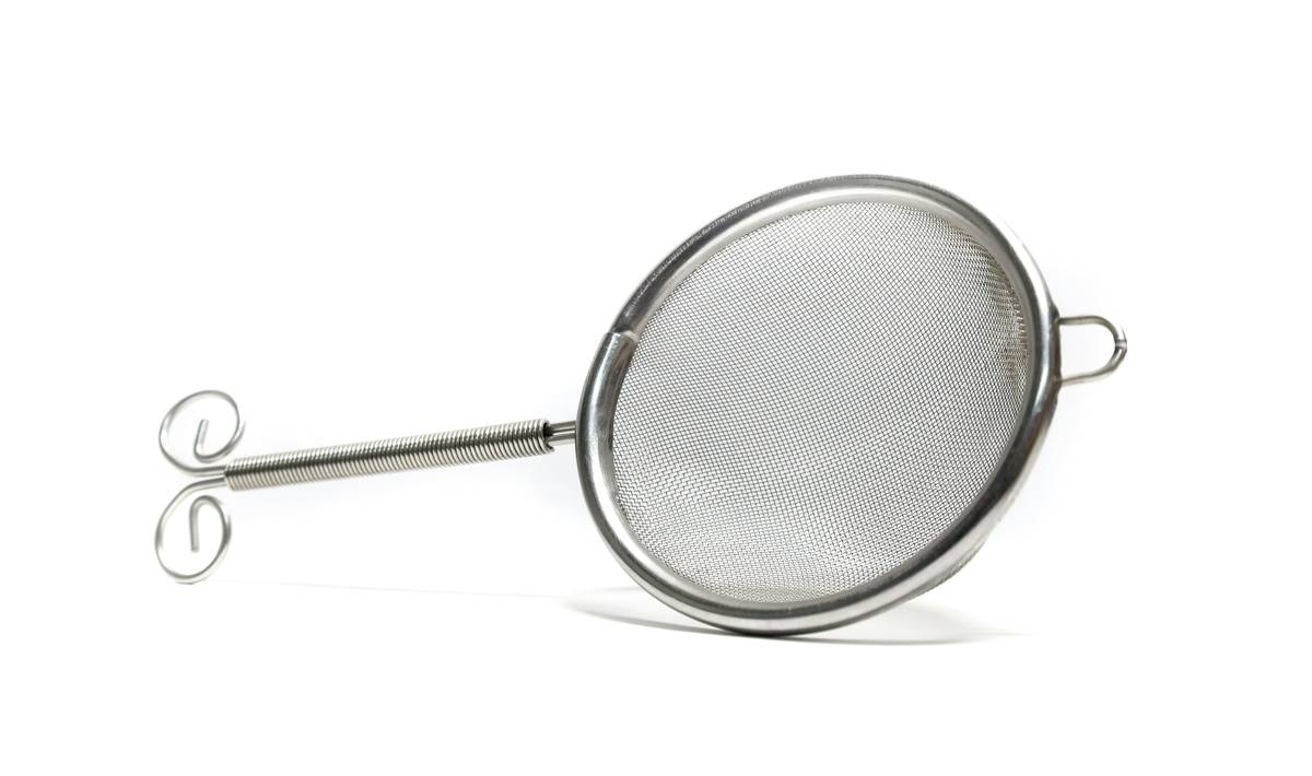 Eco friendly coffee cups with lids made of stainless steel on a kitchen counter with morning light
